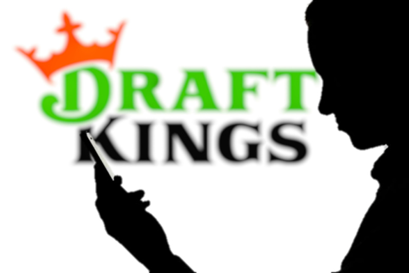 DraftKings logo and person on the phone