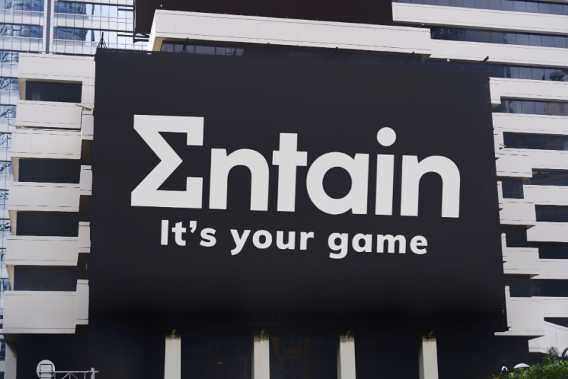 Entain logo on a billboard