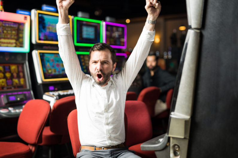 Man celebrating slots win