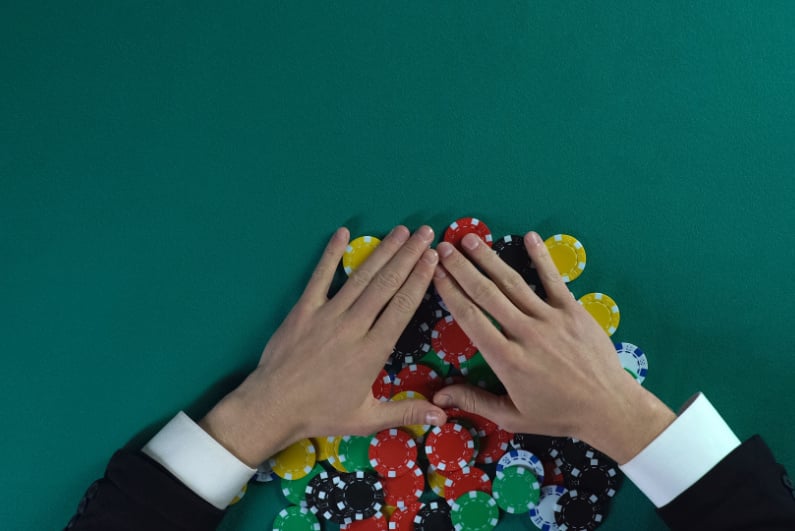 Man taking poker chips