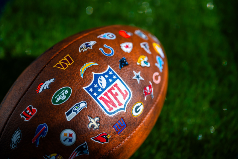 Football decorated with team logos