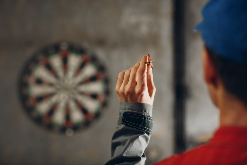 Man throws darts