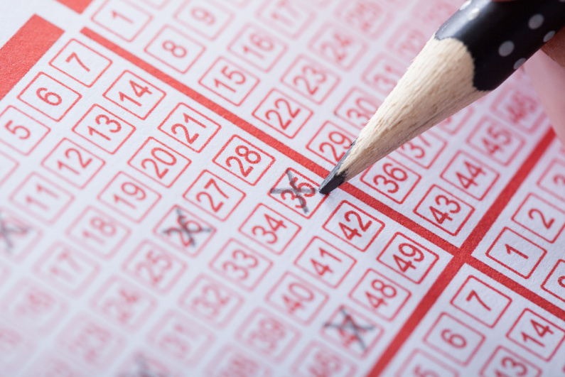 Closeup of person filling out a lottery ticket form