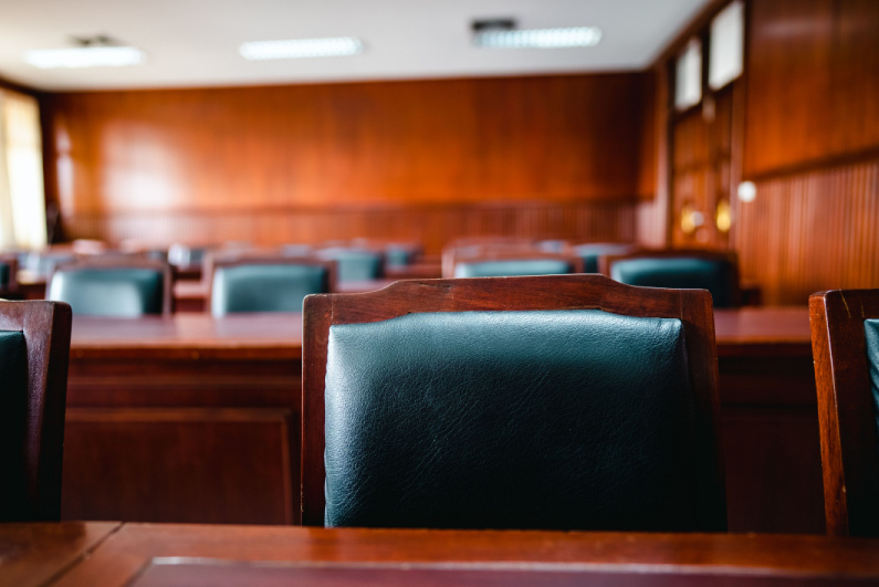 Empty chair in courtroom