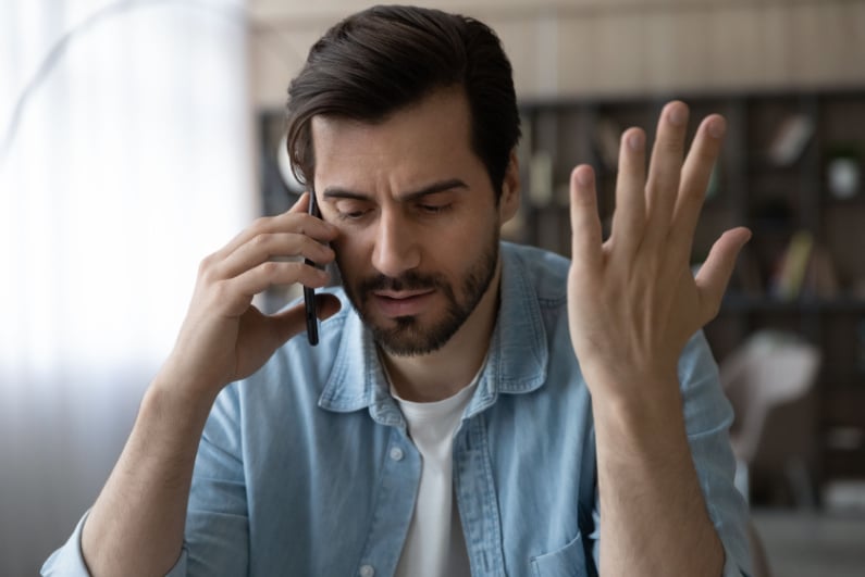 Frustrated man on phone