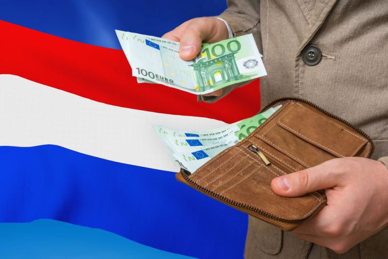 Netherlands emblem and man pinch money