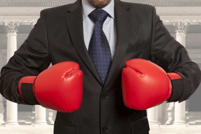 Man in suit with boxing gloves