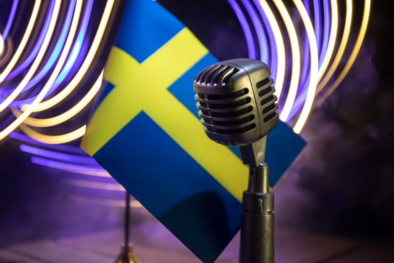 Swedish flag with a microphone
