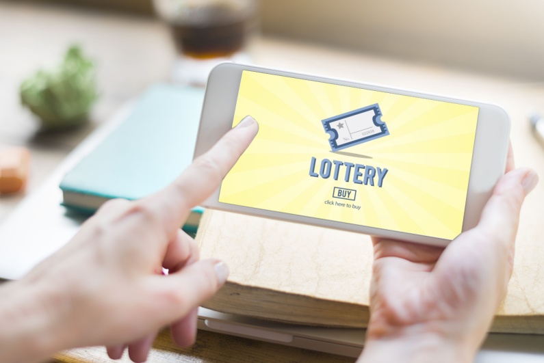 Person playing the lottery on phone