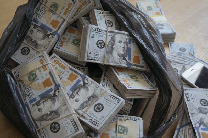 Plastic bag full of cash