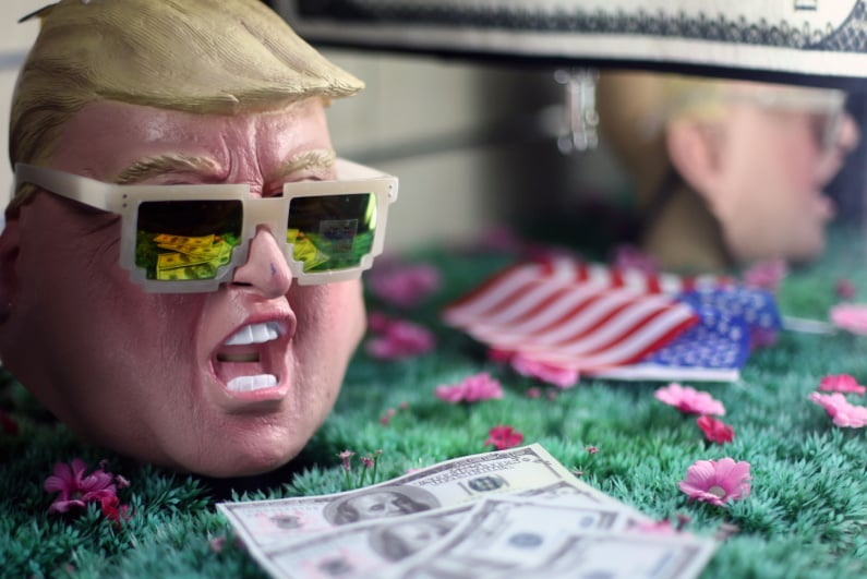 Donald Trump mask next to cash