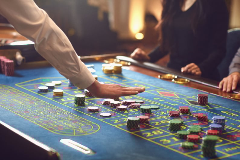 Roulette croupier signaling no more bets