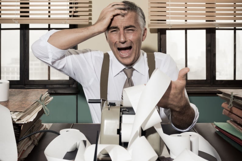 Accountant upset about long adding machine tape