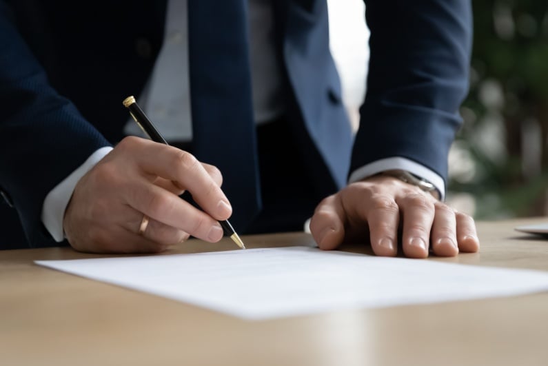 Person signing contract