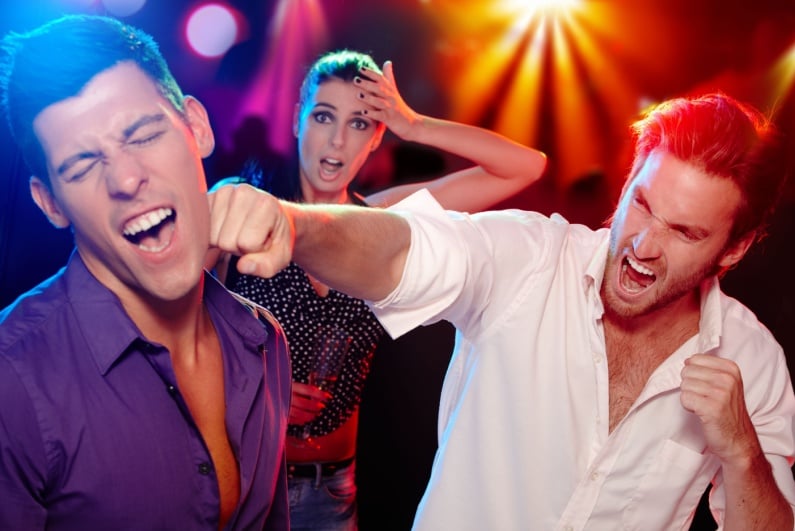 Man throwing punch on dance floor
