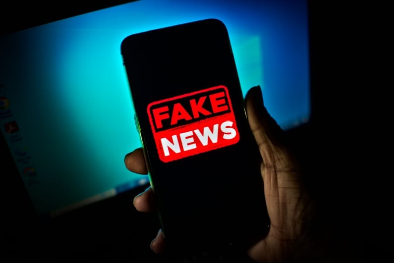 Fake news logo on phone