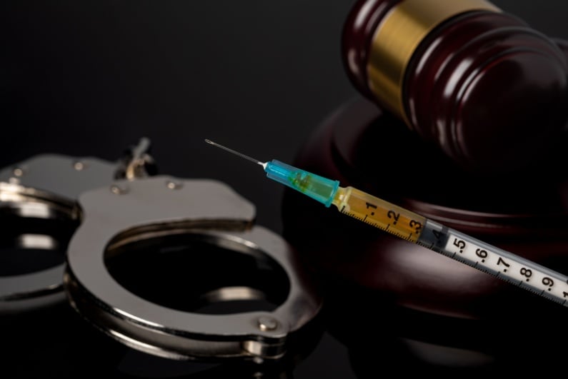 Handcuffs and needle