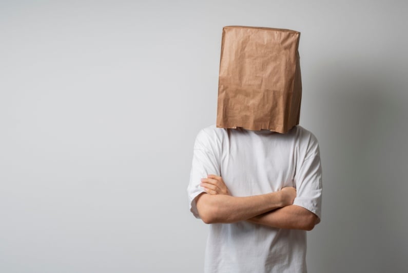 Person with bag on head