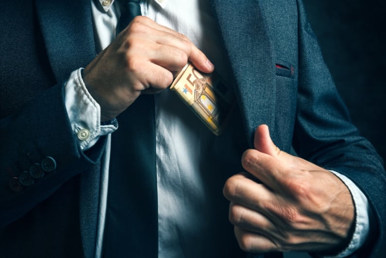 Man hiding money