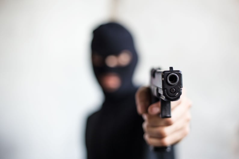 Robber with gun
