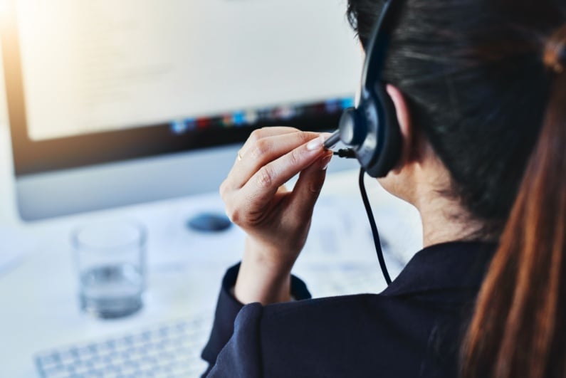 Woman taking call on a headset