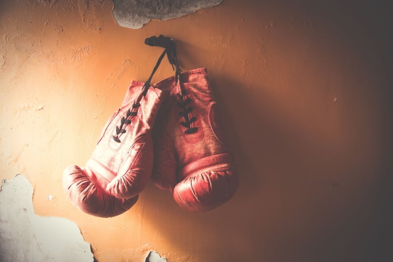 Boxing gloves hanging on wall