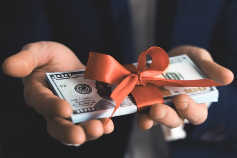 Cash wrapped in bow