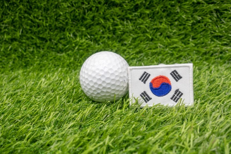Golf ball next to Korean flag patch