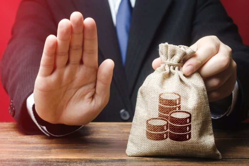 Hand up with money in bag