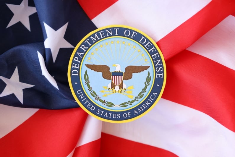 US Department of Defense logo on US flag