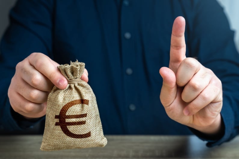 Person wagging finger with money bag