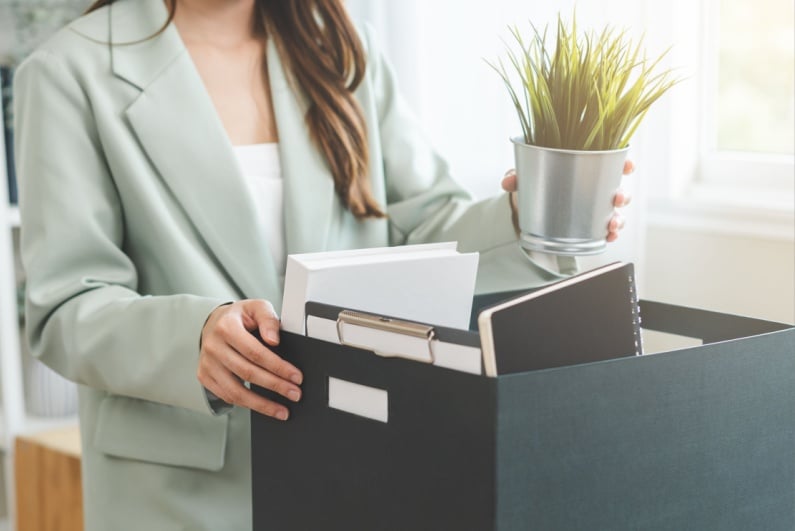 Person with box in office