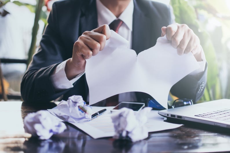 Person ripping paper
