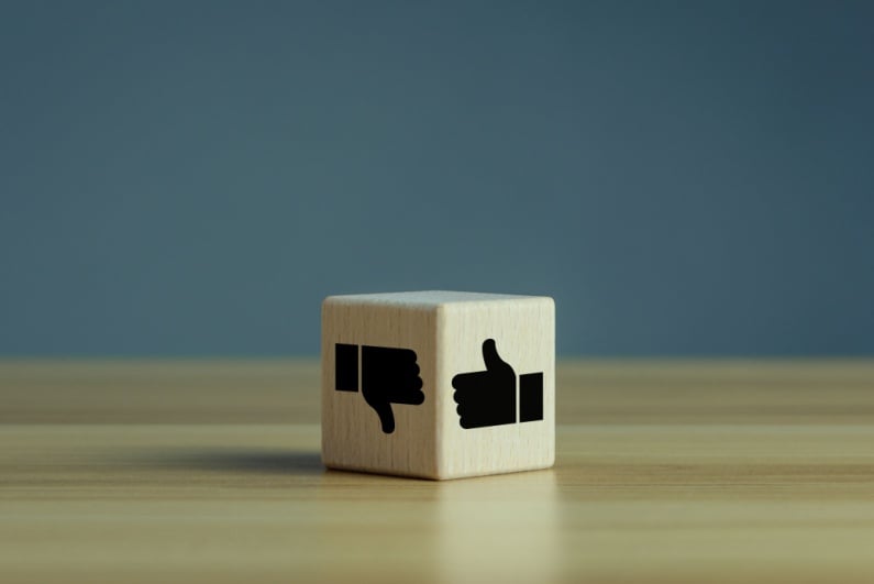 Thumbs-up and thumbs-down on a cube