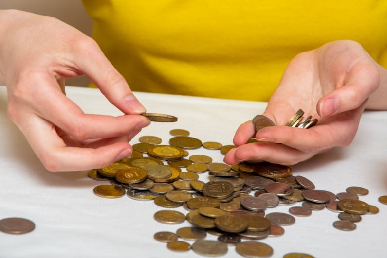 Person sorting through coins