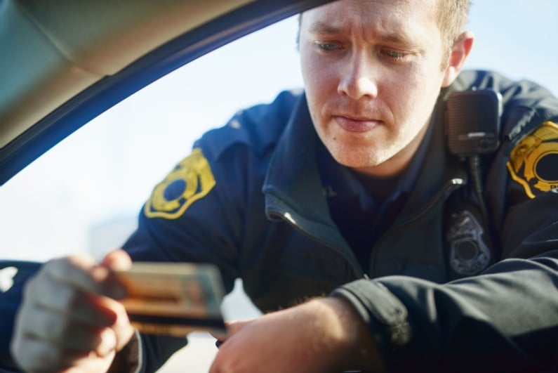 Cop checking ID