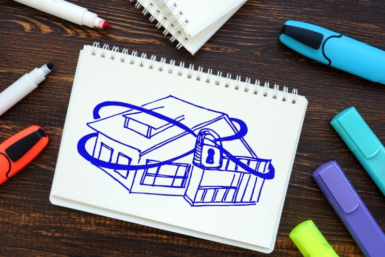 Sketch of house bound by lock and chains