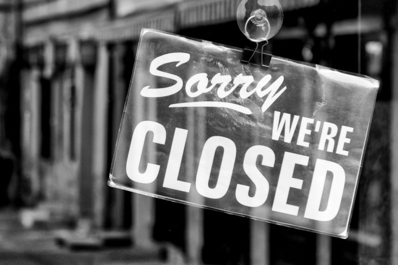 Sorry We're Closed sign black and white