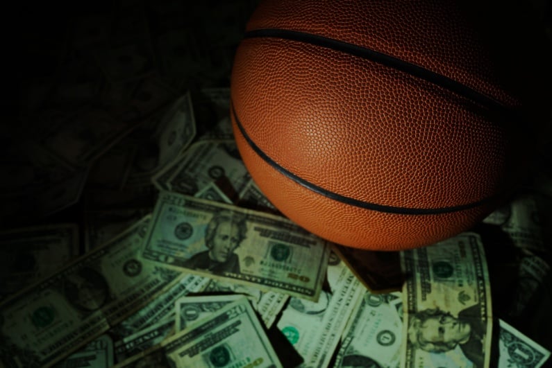 Basketball on pile of cash