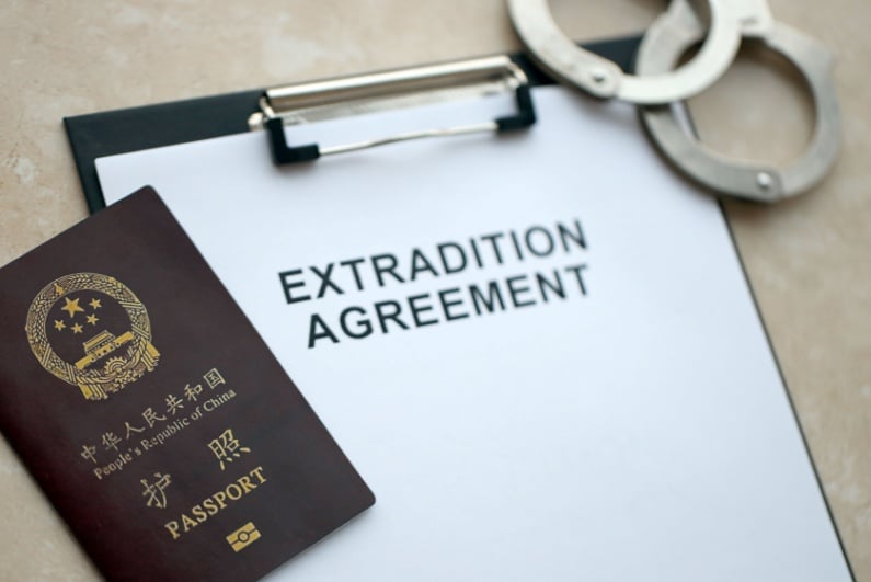 Extradition agreement paper with Chinese passport