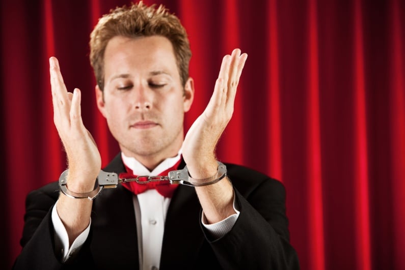 Magician in handcuffs