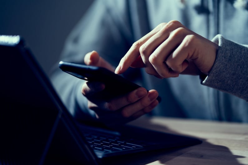 Man sending an abusive text