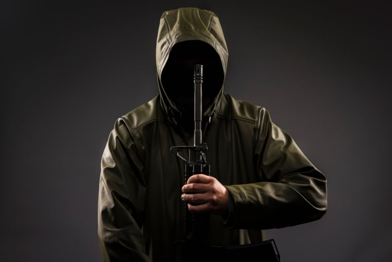 Man holding AR rifle