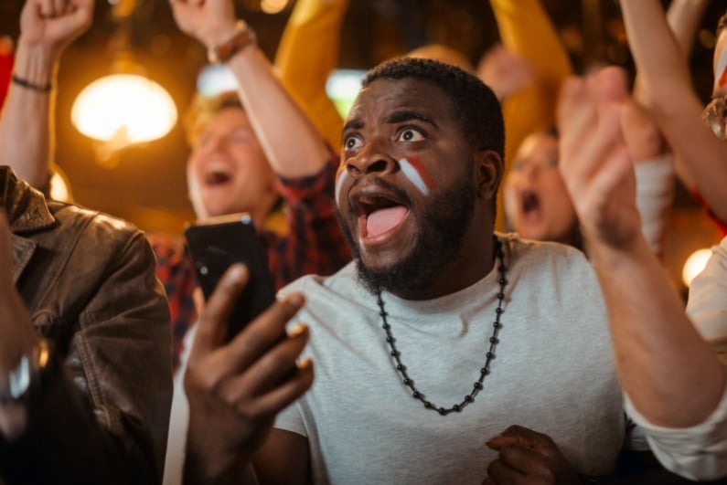 Excited fan at sports bar