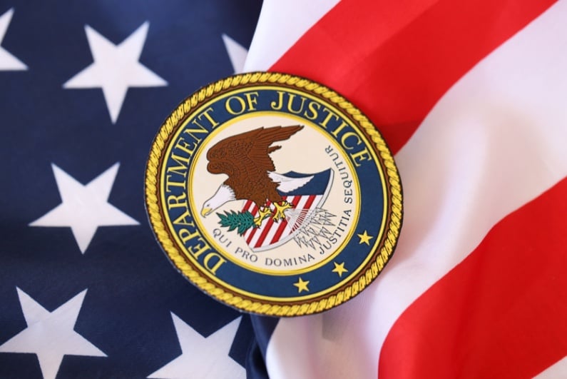 Department of Justice logo on US flag