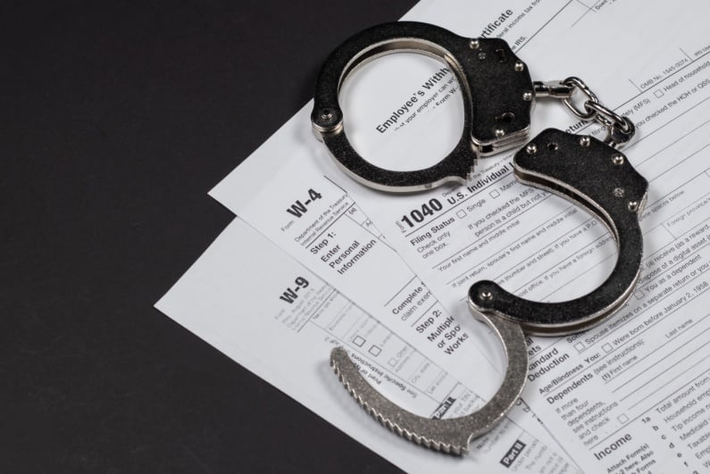 Handcuffs and tax evasion docs