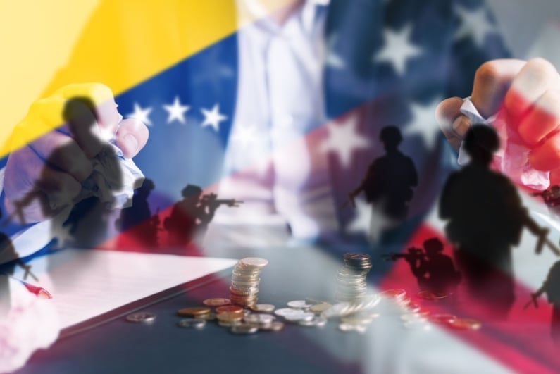 US, Venezuela flags in conflict concept