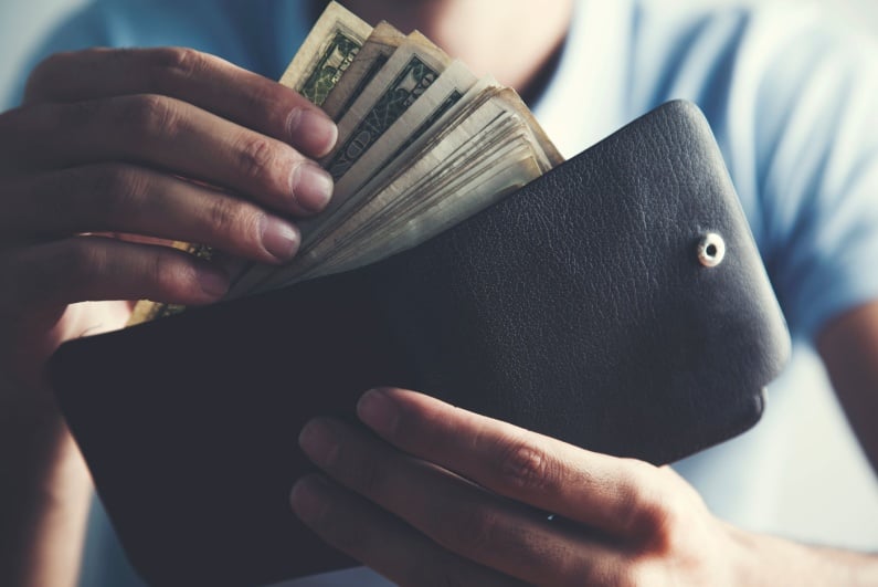 Man taking money from wallet