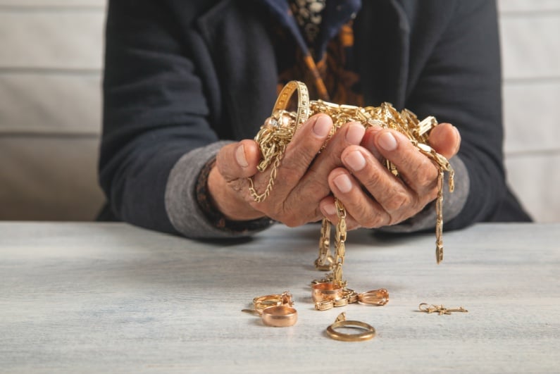 Person holding gold