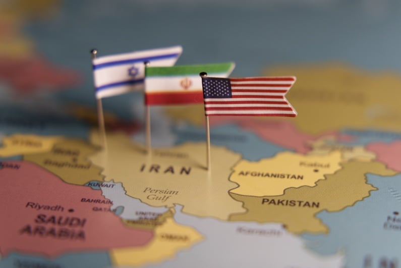 Israel Iran USA flags on map of Iran